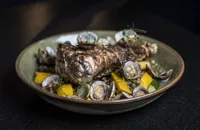 Monkfish with clams, black-eyed beans and courgettes