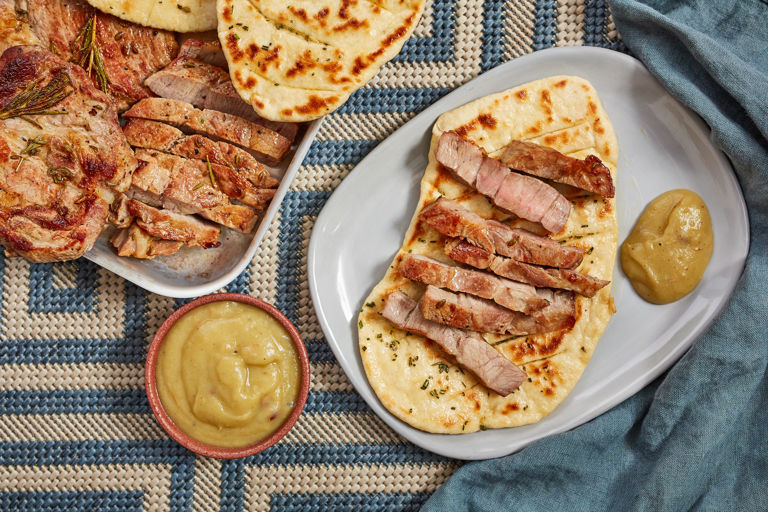 Barbecued pork shoulder steaks with smoked apple and garlic rosemary flatbreads