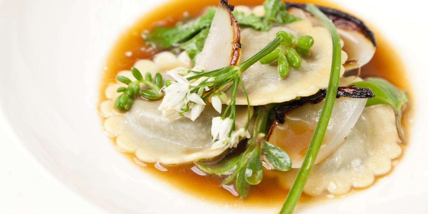 Laverbread ravioli with roasted onion stock and Welsh beach vegetables