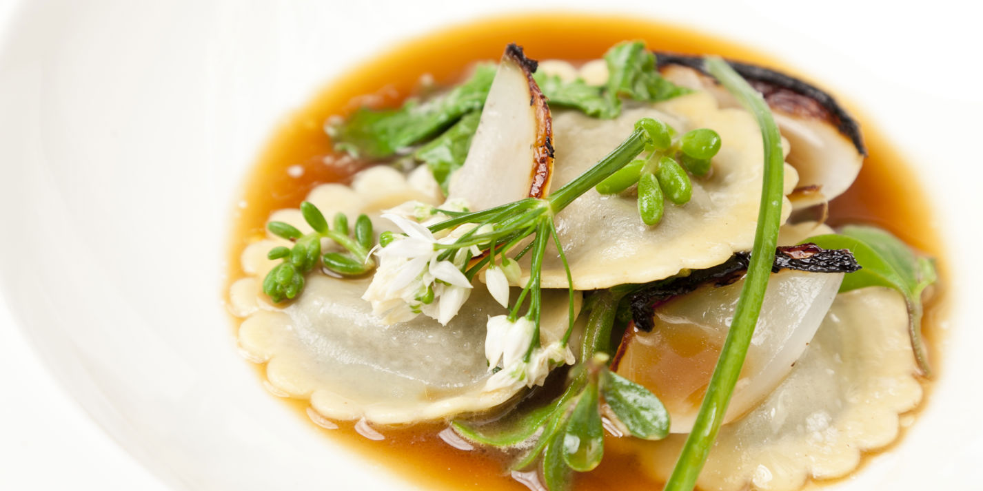 Laverbread ravioli with roasted onion stock and Welsh beach vegetables