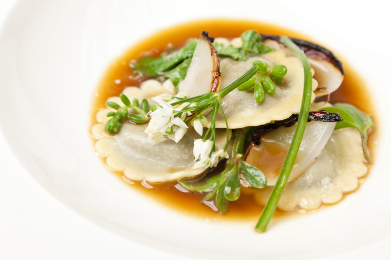 Laverbread ravioli with roasted onion stock and Welsh beach vegetables