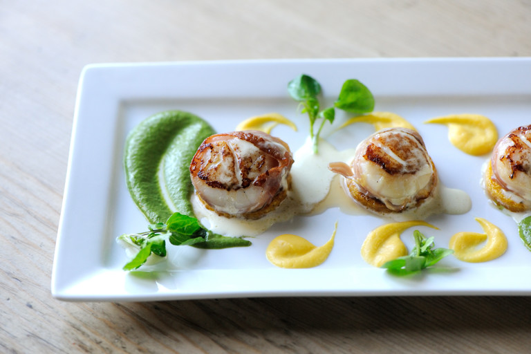 Scallops wrapped in prosciutto ham with butternut squash and watercress purée