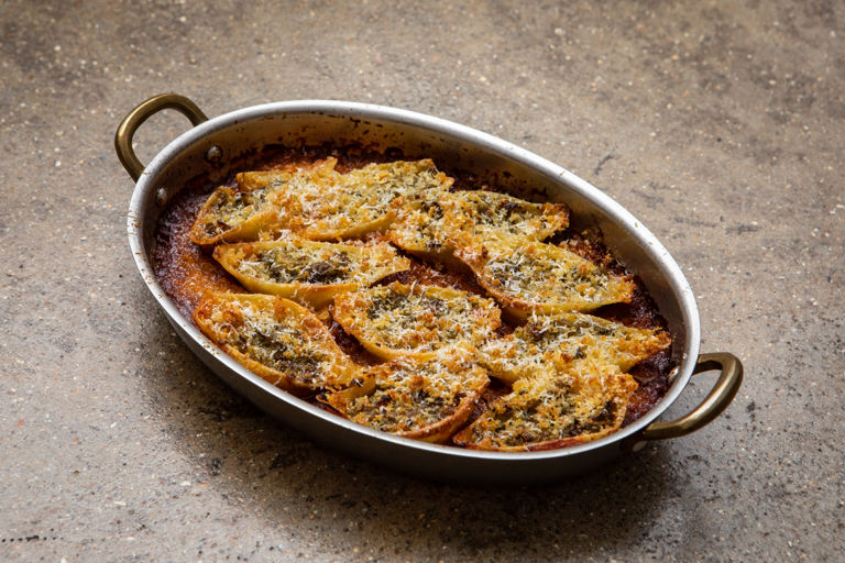 Baked conchiglioni stuffed with broccoli and anchovy and tomato sauce