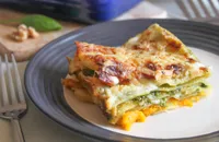 Cheesy roasted squash lasagne with spinach and walnut pesto