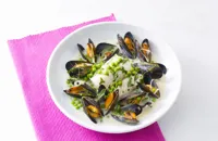 Poached cod with mussels, peas and parsley