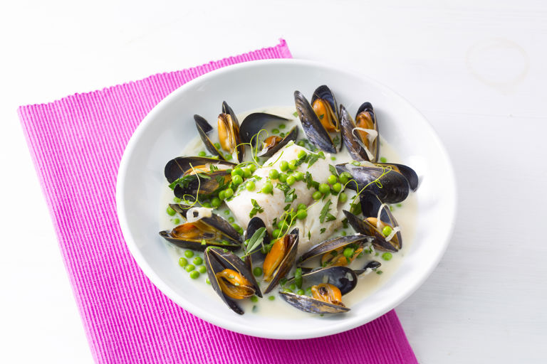 Poached cod with mussels, peas and parsley