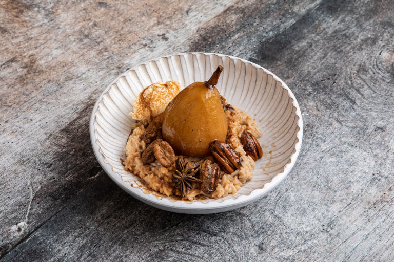 Rice pudding with rum poached pears, cinnamon and caramelised pecans