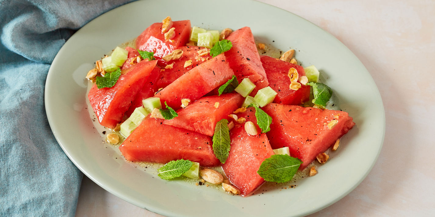 Salted watermelon salad with mint, almond, cucumber and chilli