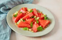 Salted watermelon salad with mint, almond, cucumber and chilli