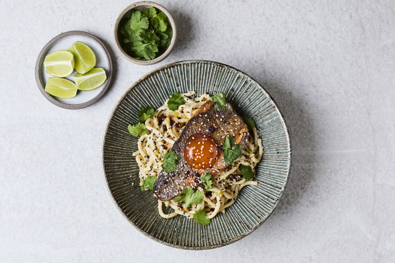 Sea bass with spring onion and ginger noodles and a cured egg yolk