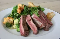 Warm Irish salad with sirloin steak and shamrock greens