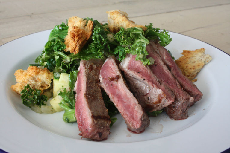 Warm Irish salad with sirloin steak and shamrock greens