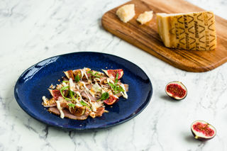Smoked duck breast salad with Grana Padano sauce, hazelnuts and bonito