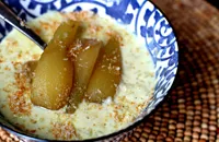 Indian-spiced coconut rice pudding with aromatic poached pears