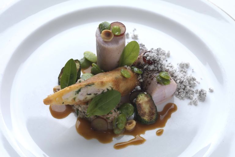 Loin of rabbit with rabbit spring roll and tomato couscous