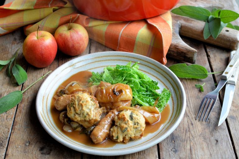 Sausage and apple casserole with herb-crusted dumplings