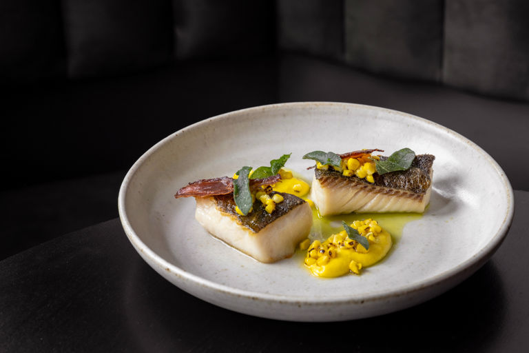Butter roasted black cod with BBQ sweetcorn, sage and bacon