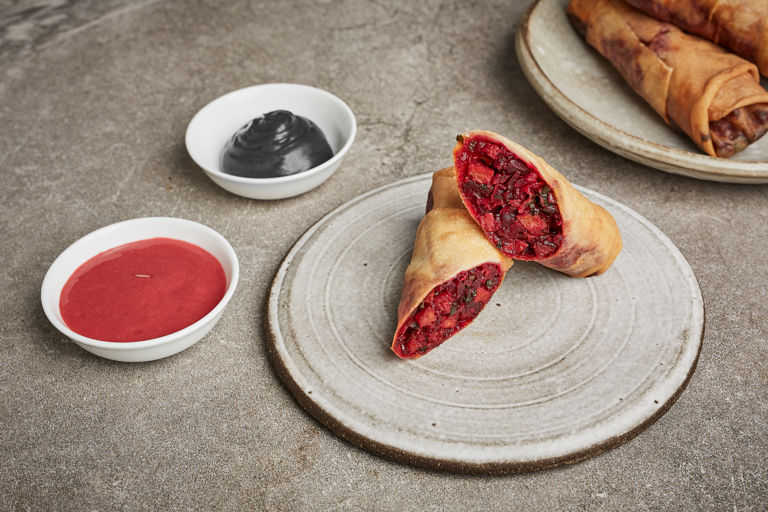 Chorizo and beetroot spring rolls with black garlic emulsion and raspberry ketchup