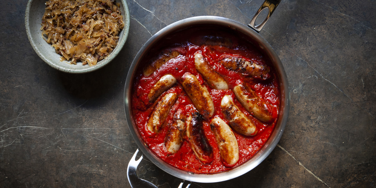 image of Lamb Sausages in Tomato Sauce With Bacon Sauerkraut recipe by Great British Chefs