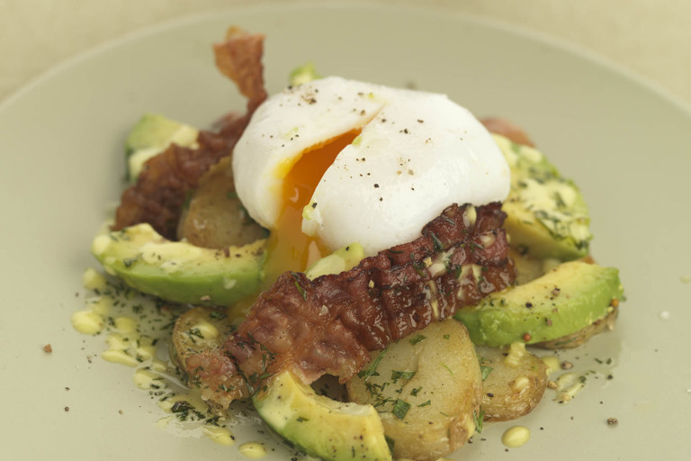 Warm salad of royal kidney potatoes with crisp pancetta, soft poached duck egg and avocado