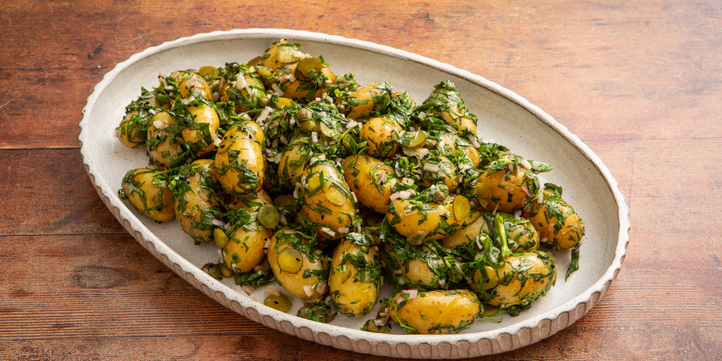 https://media-cdn2.greatbritishchefs.com/media/ldwede5k/herby-new-potato-salad.whqc_1426x713q80.jpg