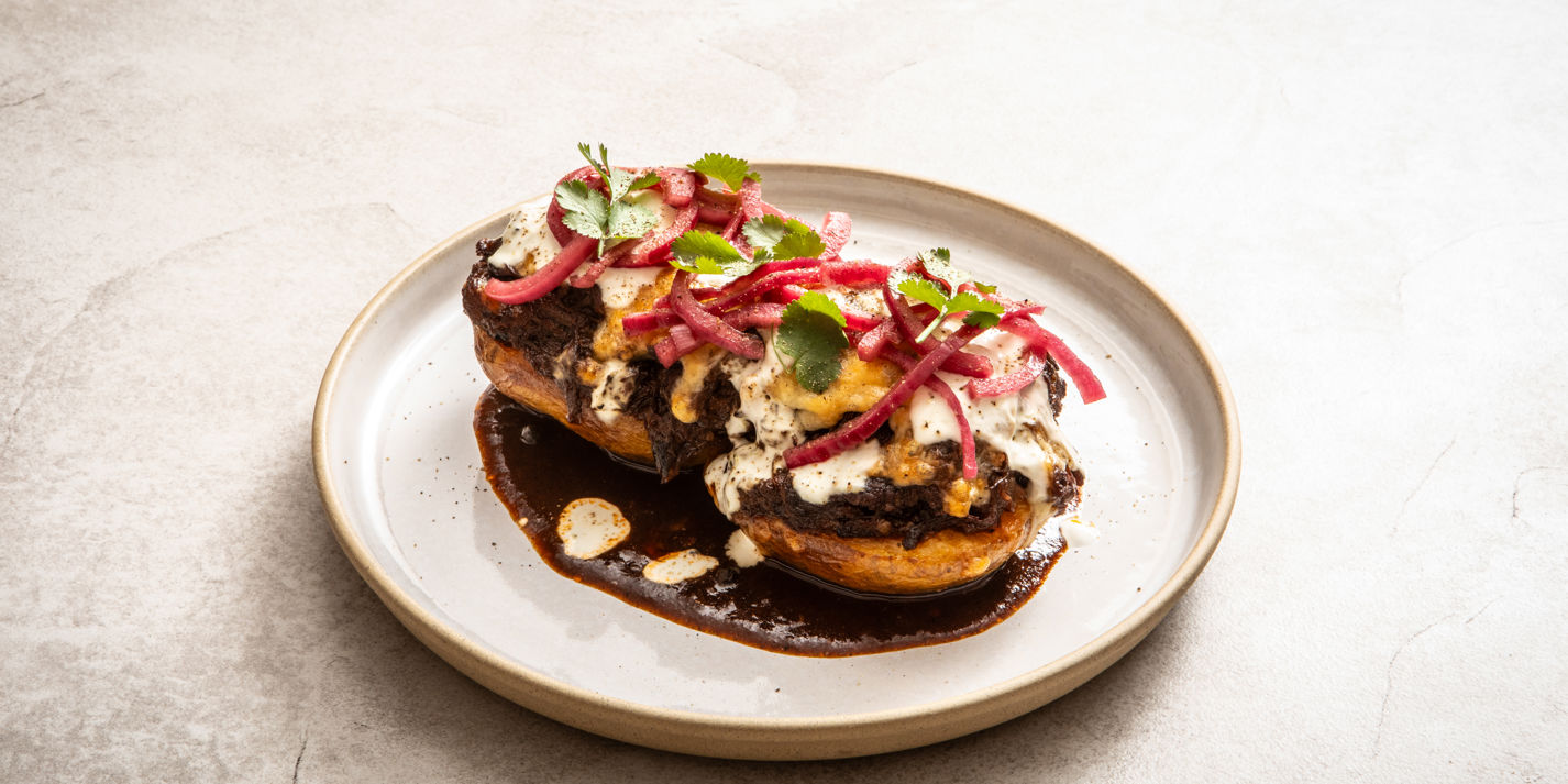 Beef Birria-Loaded Jacket Potatoes With Lime Crema Recipe - Great British Chefs