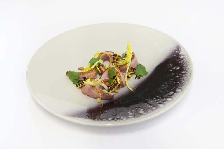 Salad of duck breast with orange, pine kernels and dandelion