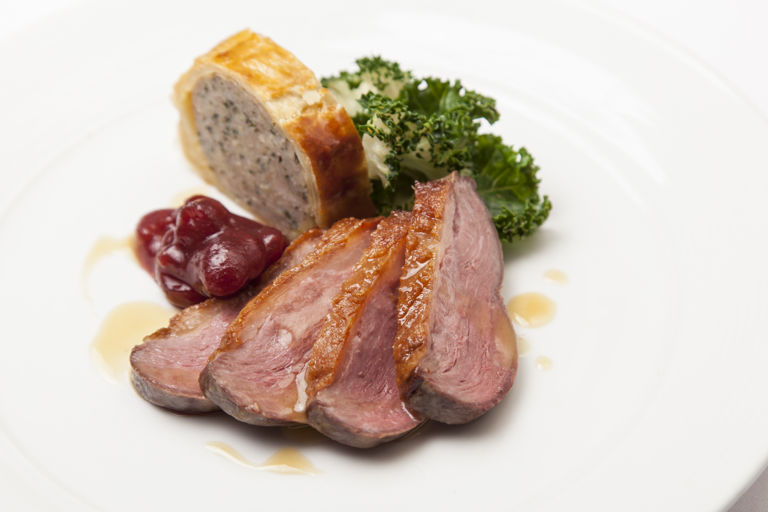Goose breast with goose leg sausage roll, kale and cranberry relish