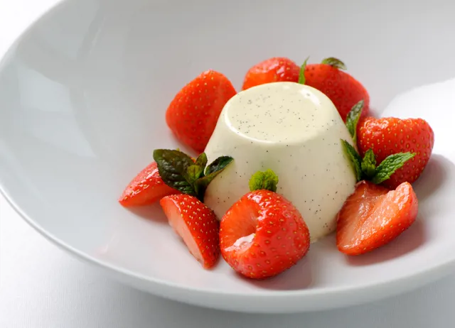 Vanilla panna cotta with strawberries and Grappa