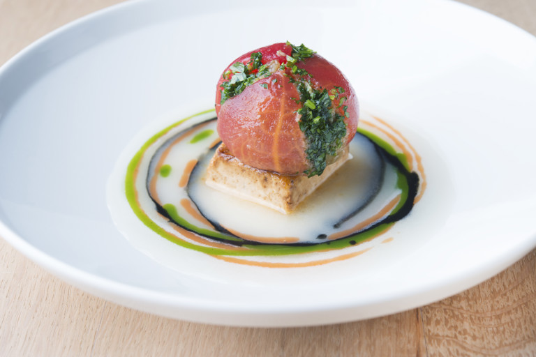 Roasted tofu with tamari soy sauce and ginger, aubergine flower and tomato emulsion