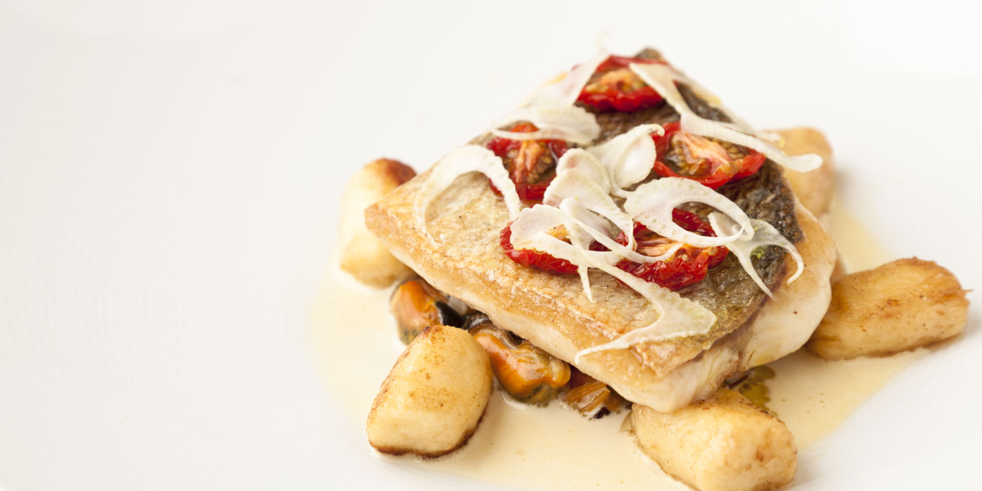 Pan-fried sea bass with Brancaster mussels, gnocchi and fennel