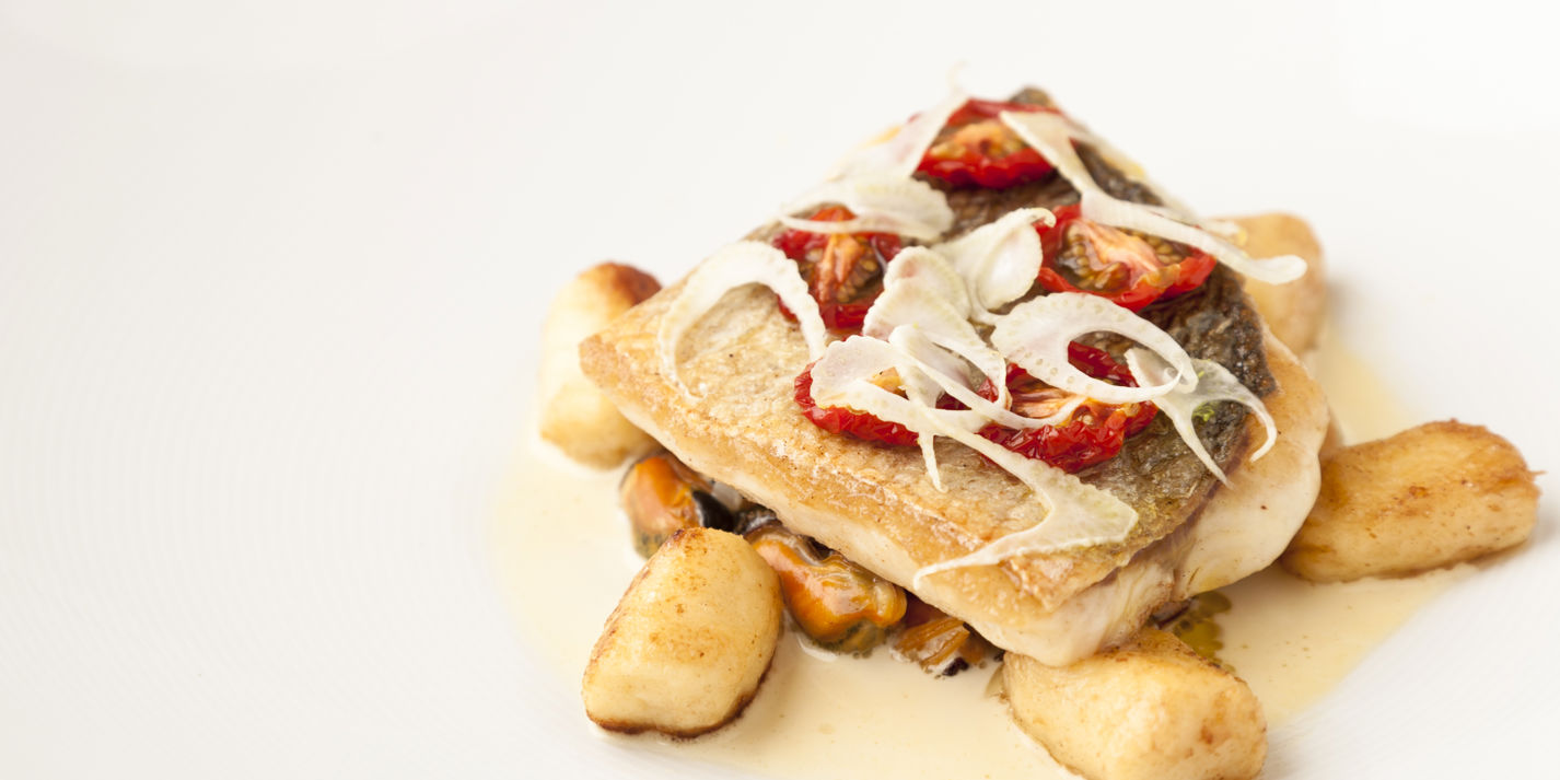 Pan-fried sea bass with Brancaster mussels, gnocchi and fennel