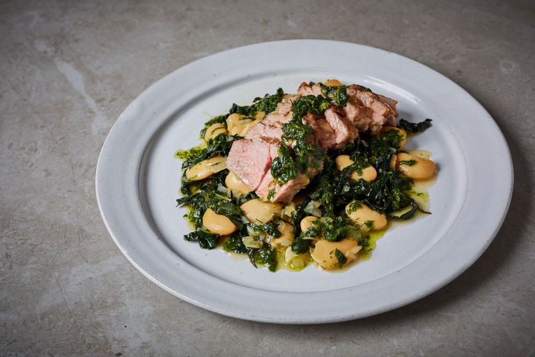 Lamb neck fillet with braised butter beans, cavolo nero and green sauce