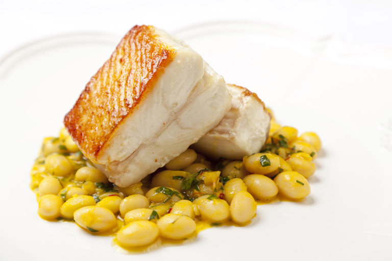 Pan-roasted Alaska halibut with coco bean, saffron and chardonnay