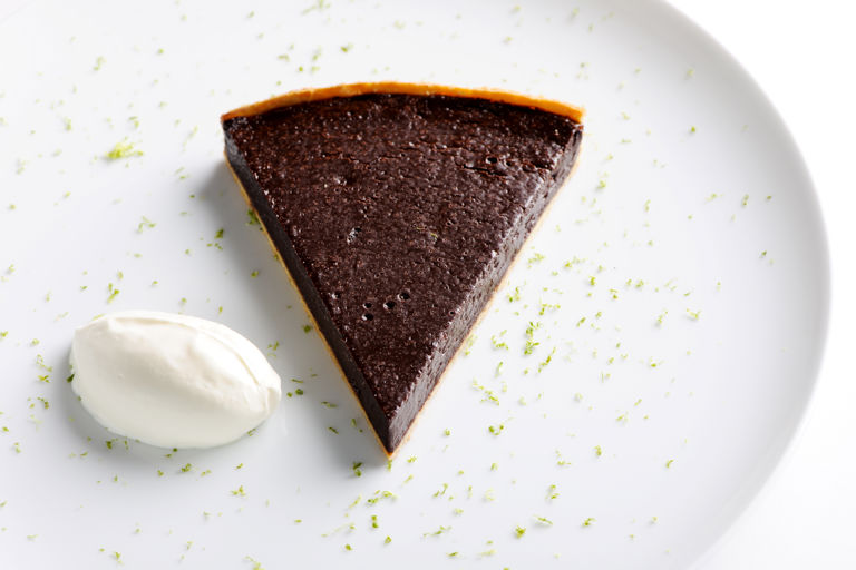 Chocolate and chilli tart with crème fraîche and lime