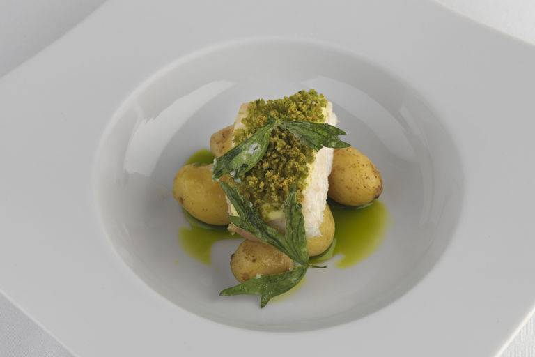 Soft lovage-crusted brill with new potatoes