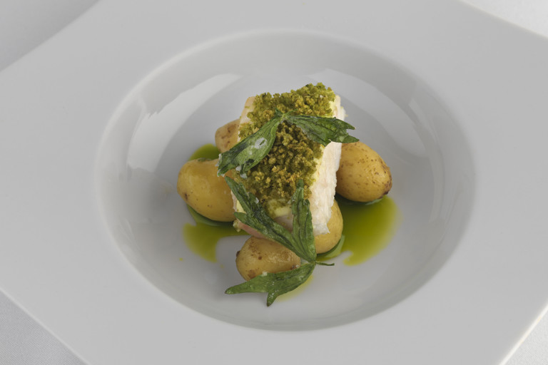 Soft lovage-crusted brill with new potatoes