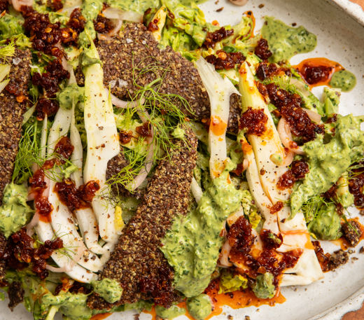 Green goddess-tahini salad with chilli crisp and flaxseed crackers