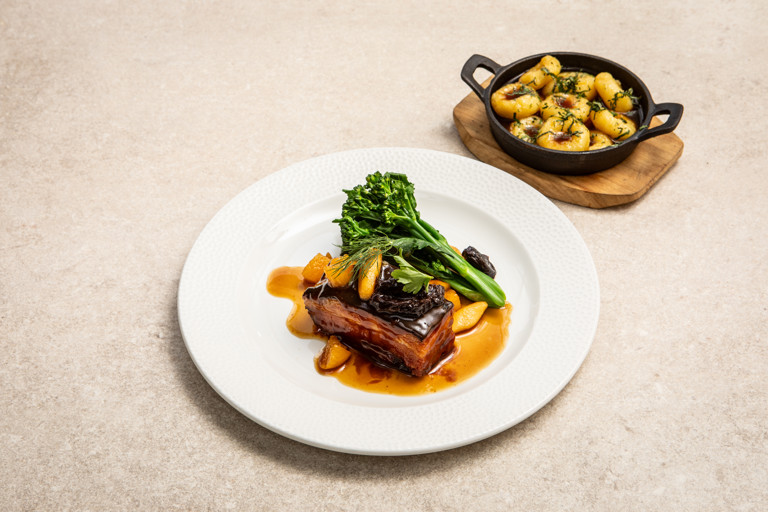 Slow-cooked pork belly with apricot, prunes and apple and Silesian dumplings