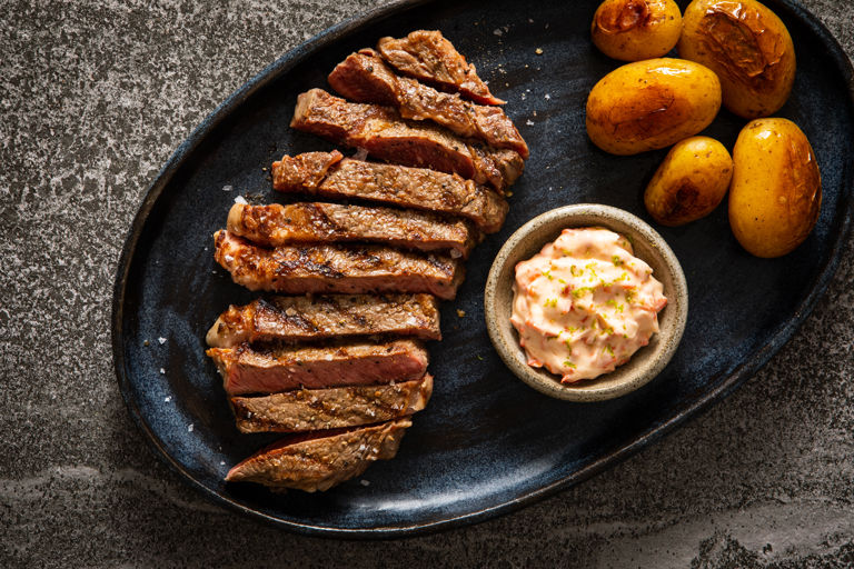 Rib-eye with miso and butter-braised new potatoes and charred chilli and lime mayo