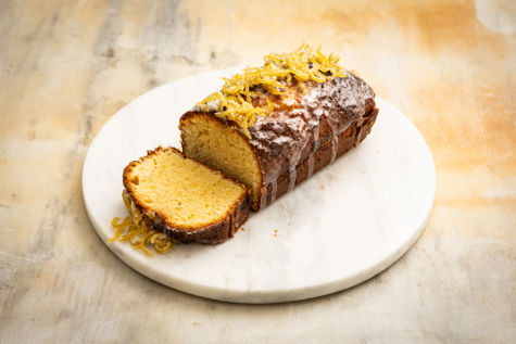 Frosted lemon and olive oil cake with candied lemon zest 