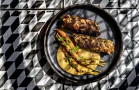 Rabbit and pork fat kebab with Sulla sauce and carrot pickle
