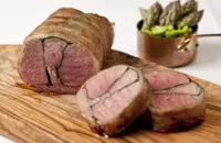 Roast whole saddle of lamb with spinach and black pudding
