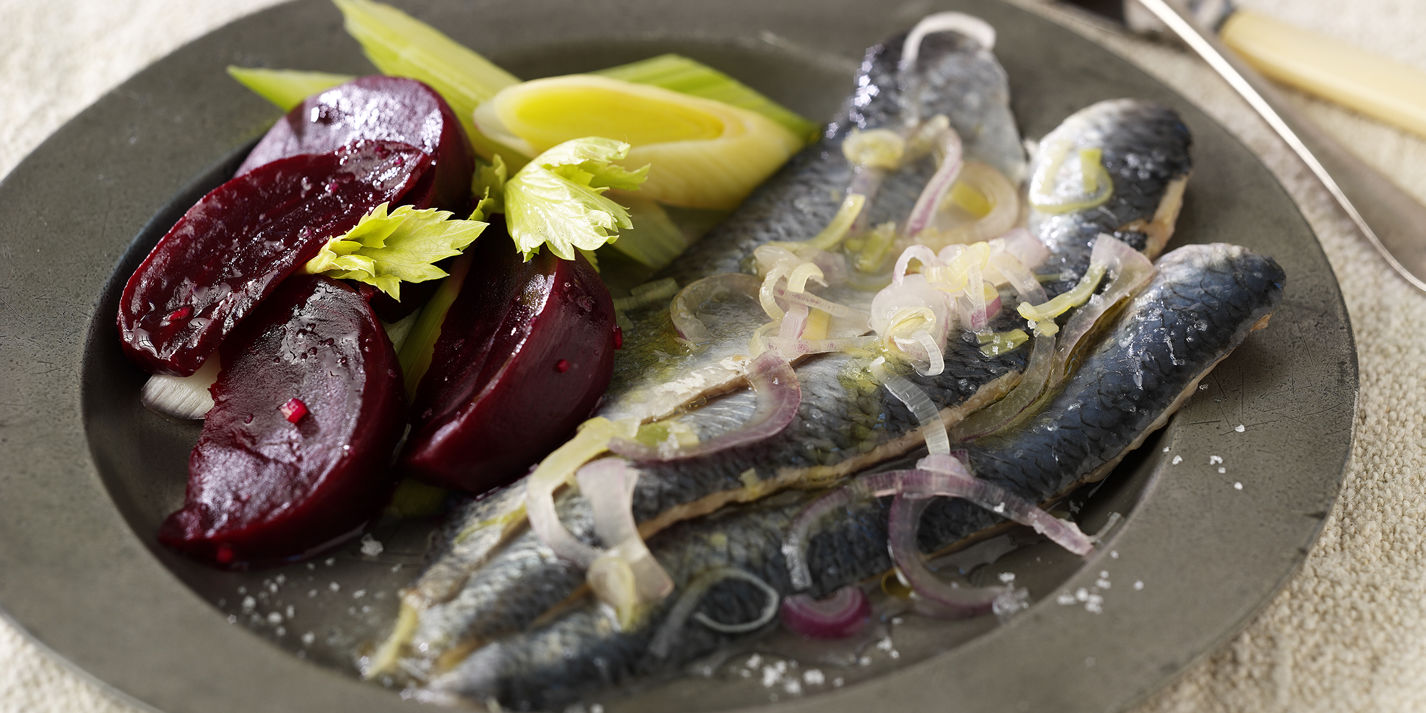Marinated herrings with beetroot, leeks and horseradish