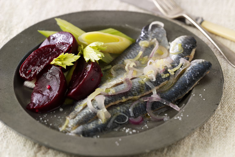 Marinated herrings with beetroot, leeks and horseradish