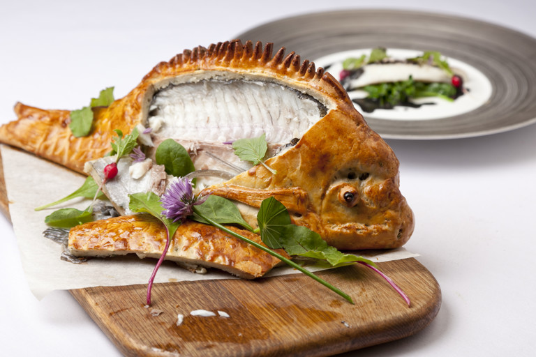 Baked bream with wilted spinach, radish and nero sauce