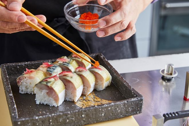 Japanese sushi roll set with red flying fish caviar. Pickled