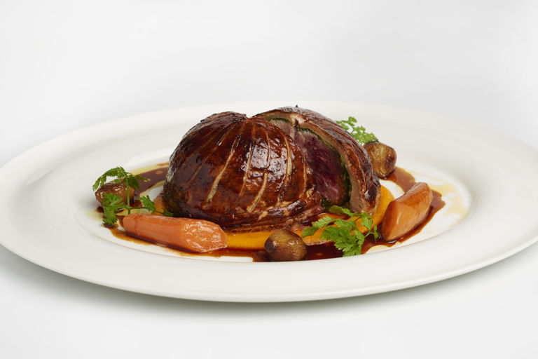 Pithivier of game, carrot purée and glazed onions