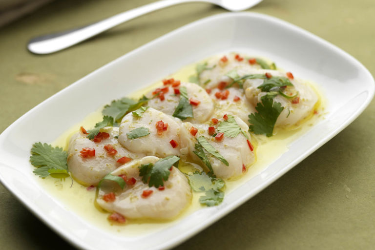 Scallop carpaccio with basil, coriander, mint and lime