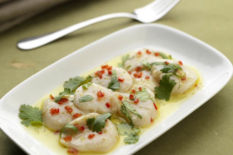 Scallop carpaccio with basil, coriander, mint and lime